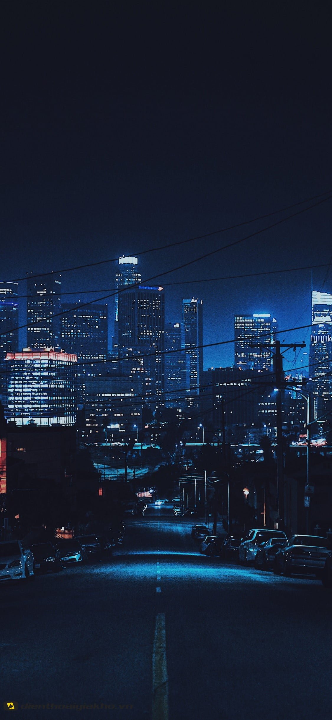 Hình nền iphone 10 với khung cảnh thành phố sáng đèn vào buổi đêm, đẹp lung linh huyền ảo, giúp nổi bật các icon, app điện thoại của bạn