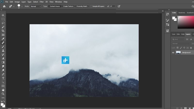 Tiếp tục bôi từ từ từng phần cho đến khi watermark hoàn toàn biến mất