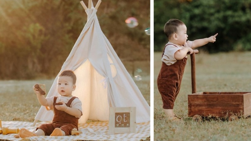 Hình ảnh em bé trai đang chơi đùa vui vẻ thể hiện sự hồn nhiên và đầy sức sống của tuổi thơ